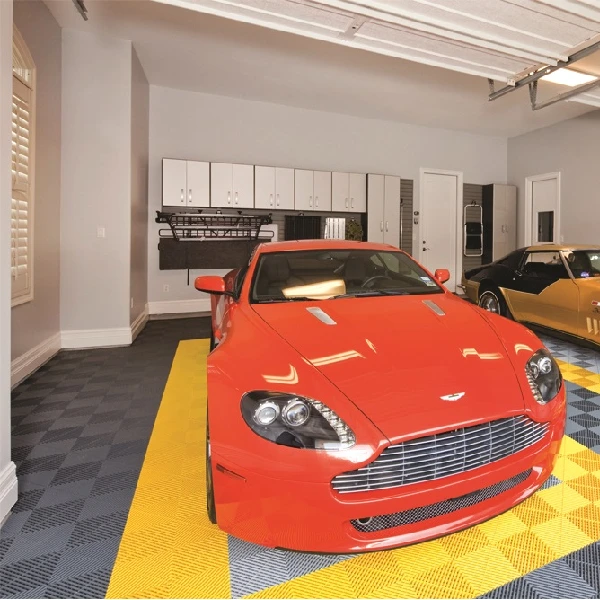 home garage featuring a patterned floor made of interlocking gray and yellow PVC tiles