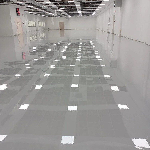 light gray epoxy floor in an empty, minimalist basement garage