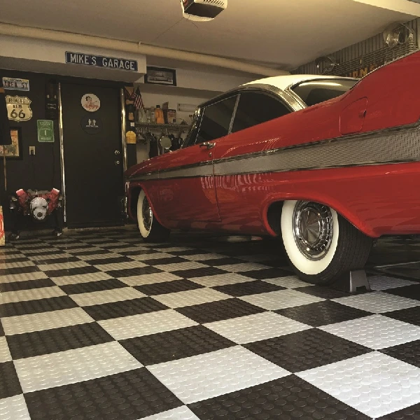 workshop garage featuring a classic black and white checkered floor