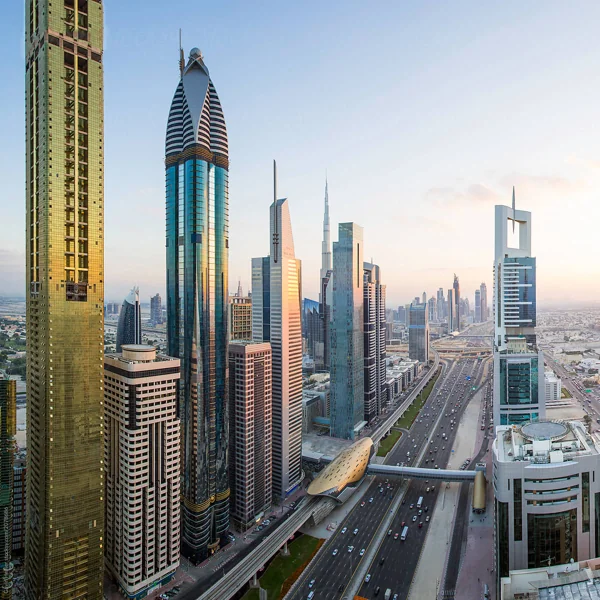 Dubai skyline with modern skyscrapers and elevated train track.