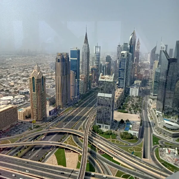 Dubai skyline with modern skyscrapers and elevated highways.