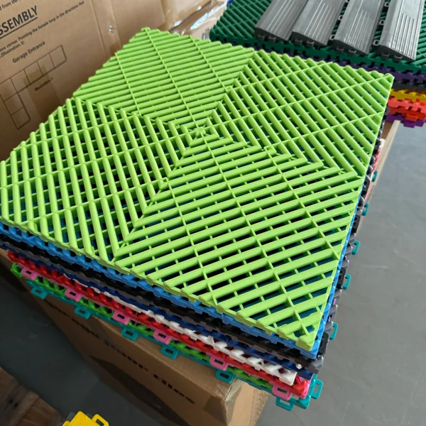 Stack of colorful interlocking PVC garage floor tiles