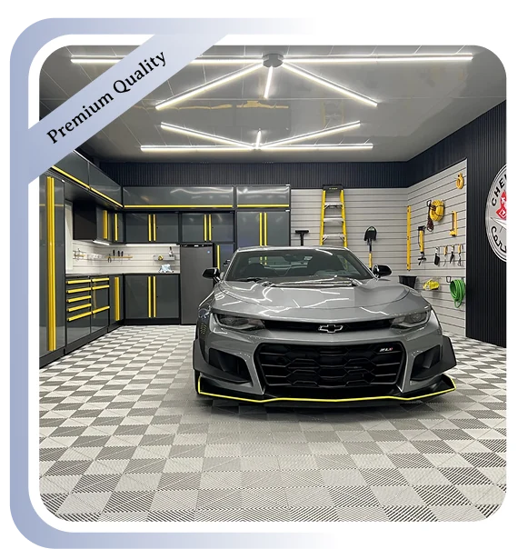 Modern garage with gray and yellow cabinets, a sleek gray car, and checkered PVC flooring.