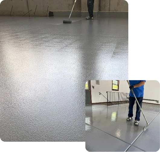 Applying gray epoxy floor coating with a roller in a garage setting.